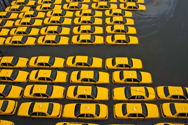 A parking lot full of yellow cabs in Hoboken, New Jersey. (Photo by Charles Sykes/Associated Press)
