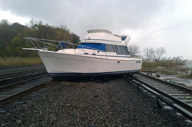 A boat rests on the tracks at Metro-North's Ossining Station on the Hudson Line in the aftermath of Hurricane Sandy, in New York, on October 30, 2012. (Photo by Reuters/MTA)