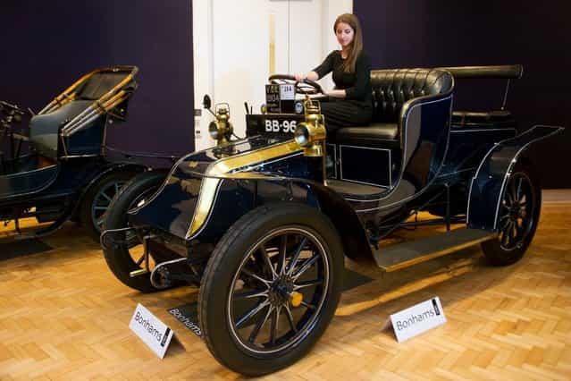 Bonhams employee, Sarah Gubbins sits in a 1904 Wilson-Pilcher, thought to be the oldest surviving example of its type on November 1, 2012 in London, England. The Car is part of a Veteran Car Sale at Bonhams and is valued at around 220,000 pounds (Photo by Bethany Clarke)