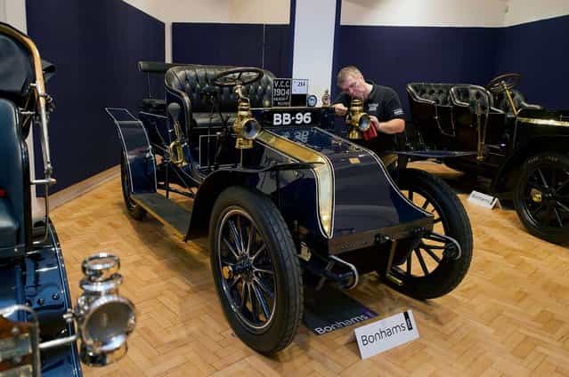 Bonhams employee Craig Binns polishes a1904 Wilson-Pilcher, thought to be the oldest surviving example of its type on November 1, 2012 in London, England. The Car is part of a Veteran Car Sale at Bonhams and is valued at around 220,000 pounds (Photo by Bethany Clarke)