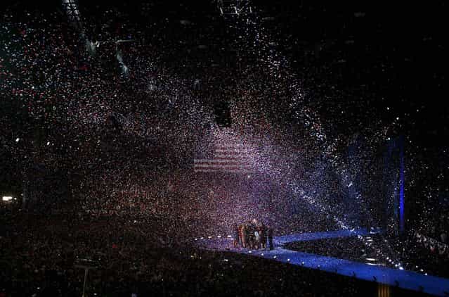 Confetti falls on President Obama, Vice President Joe Biden, their families and supporters after Obama's victory speech on November 7, 2012. (Photo by Kirsten Luce/The New York Times)