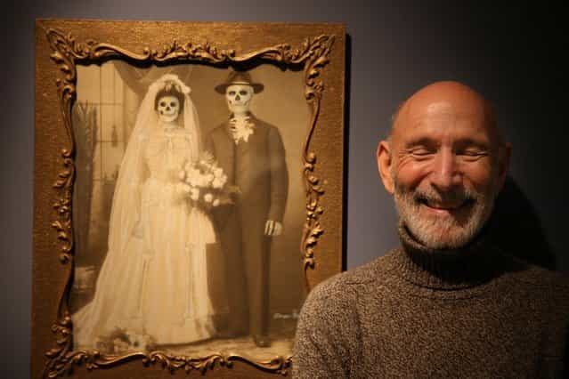 Collection owner Richard Harris stands in front of a work my Mexican artist Marcos Raya called Family Portrait : Wedding at the [Death: A Self-portrait] exhibition at the Wellcome Collection on November 14, 2012 in London, England. The exhibition showcases 300 works from a unique collection by Richard Harris, a former antique print dealer from Chicago, devoted to the iconography of death. The display highlights art works, historical artifacts, anatomical illustrations and ephemera from around the world and opens on November 15, 2012 until February 24, 2013. (Photo by Peter Macdiarmid)