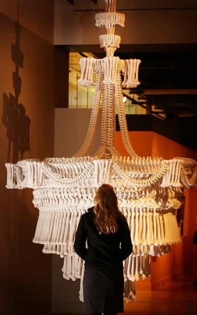 A chandelier made from plaster casts of bones by artist Jodie Carey is displayed at the [Death: A Self-portrait] exhibition at the Wellcome Collection on November 14, 2012 in London, England. The exhibition showcases 300 works from a unique collection by Richard Harris, a former antique print dealer from Chicago, devoted to the iconography of death. The display highlights art works, historical artifacts, anatomical illustrations and ephemera from around the world and opens on November 15, 2012 until February 24, 2013. (Photo by Peter Macdiarmid)