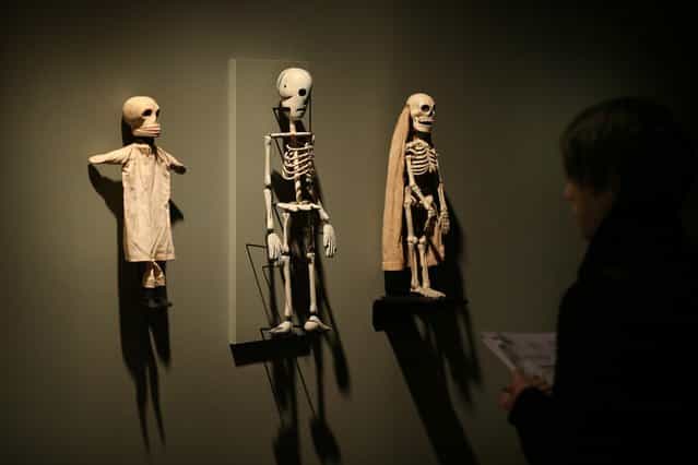 Antique American skeleton puppets are shown at the Death: A Self-portrait exhibition at the Wellcome Collection on November 14, 2012 in London, England. The exhibition showcases 300 works from a unique collection by Richard Harris, a former antique print dealer from Chicago, devoted to the iconography of death. The display highlights art works, historical artifacts, anatomical illustrations and ephemera from around the world and opens on November 15, 2012 until February 24, 2013. (Photo by Peter Macdiarmid)