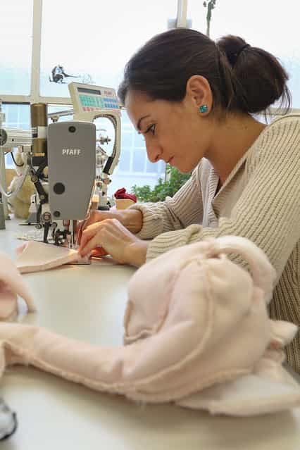 A worker sews at the Steiff stuffed toy factory on November 23, 2012 in Giengen an der Brenz, Germany. Founded by seamstress Margarethe Steiff in 1880, Steiff has been making stuffed teddy bears since the early 20th century ever since her nephew Richard Steiff exhibited the first commercially produced teddy bear in Europe in 1903. Teddy bears are among the most popular children's toys and the company is hoping for a strong Christmas season. (Photo by Thomas Niedermueller)