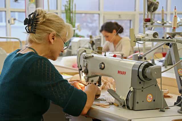 Workers sew at the Steiff stuffed toy factory on November 23, 2012 in Giengen an der Brenz, Germany. Founded by seamstress Margarethe Steiff in 1880, Steiff has been making stuffed teddy bears since the early 20th century ever since her nephew Richard Steiff exhibited the first commercially produced teddy bear in Europe in 1903. Teddy bears are among the most popular children's toys and the company is hoping for a strong Christmas season. (Photo by Thomas Niedermueller)