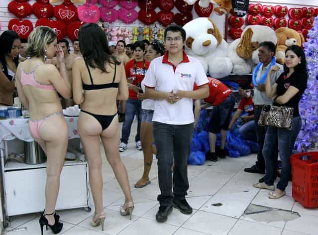 Customers in underwear shop during a special promotion at a mall in Ciudad del Este, Paraguay, on December 2, 2012. (Photo by Jose Espinola/AFP Photo)