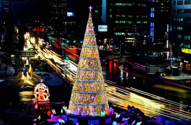 A Christmas tree stands in front of City Hall in Seoul, South Korea. (Photo by Lee Jin-man/Associated Press)