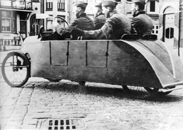 To save petrol German soldiers use a pedal car to get around in towns. 28th January 1941. (Photo by Keystone)