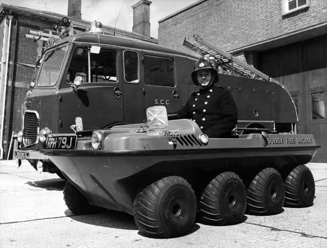 Fireman Bainbridge in the argocat at Reigate fire station, Surrey, 1971. The new vehicle has been designed by a company in Canada where it is used for forestry work, duck shooting and as a beach runabout. Completely amphibious, and equipped with balloon tyres and a two-stroke 436cc engine, the vehicle can carry up to six men and a portable pump and hose. It is intended for commando style fire-fighting in inaccessible places. (Photo by Wesley/Keystone)