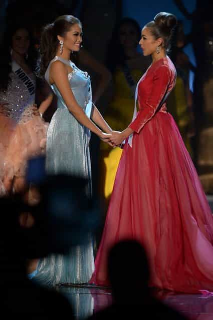 Miss Philippines, Janine Tugonon (L), and Miss USA, Olivia Culpo (R), await the judges' final decision during the Miss Universe Pageant at Planet Hollywood in Las Vegas, Nevada on December 19, 2012. Olivia Culpo was crowned Miss Universe 2012, beating out beauties from around the world to claim the coveted title. The title of first runner-up title went to the contestant from the Philippines, Janine Tugonon. (Photo by Joe Klamar/AFP Photo)