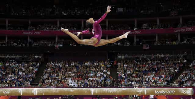 In this August 2, 2012 file photo, U.S. gymnast Gabrielle Douglas performs on the balance beam during the artistic gymnastics women's individual all-around competition at the 2012 Summer Olympics, in London. Douglas won the all-around competition. (Photo by Gregory Bull/AP Photo)