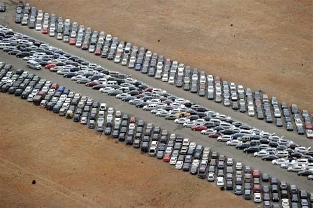 Tens of thousands of vehicles damaged by super storm Sandy are being temporarily stored on runways and taxiways at Calverton Executive Airpark in Calverton, New York, on January 9, 2013 in this aerial view. Insurance Auto Auctions Inc, a salvage auto auction company specializing in total-loss vehicles, acquired the cars and trucks that were damaged, destroyed or flooded by the storm and needed a place to store them. The company made a deal with the Town of Riverhead to lease the airport land and then the vehicles are auctioned online. AFP PHOTO/Stan HONDASTAN HONDA/AFP/Getty Images