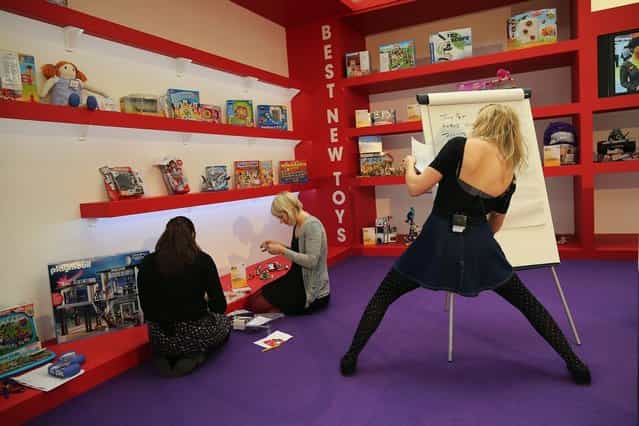 A trade stand is prepared for a demonstration during the 2013 London Toy Fair at Olympia Exhibition Centre on January 22, 2013 in London, England. The annual fair which is organised by the British Toy and Hobby Association, brings together toy manufacturers and retailers from around the world. (Photo by Dan Kitwood)