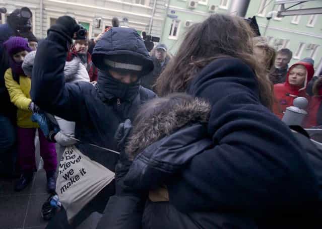 Orthodox activists clashes with a gay rights campaigner during a protest outside of the State Duma, Russian Parliament's lower chamber, in downtown Moscow, January 22, 2013. (Photo by Ilya Pitalev/RIA Novosti)