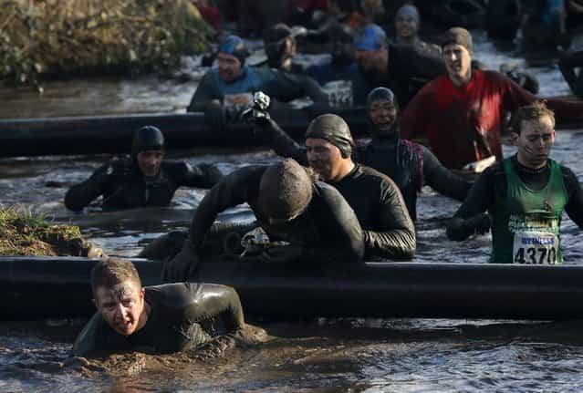 CCompetitors in action during the Tough Guy Challenge on January 27, 2013 in Telford, England. (Photo by Ian Walton)