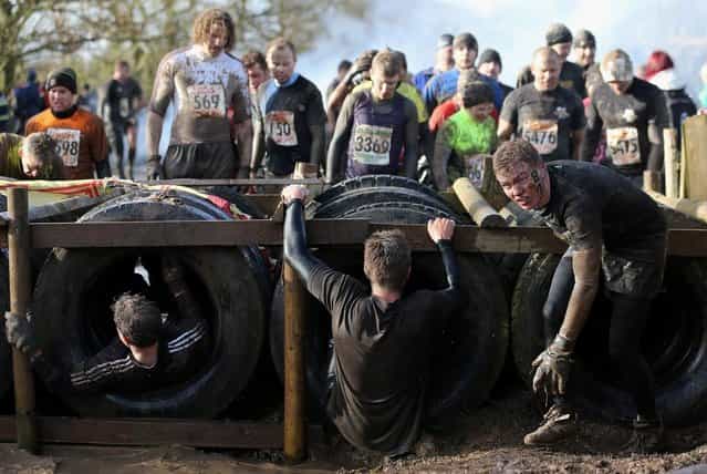 Competitors in action during the Tough Guy Challenge on January 27, 2013 in Telford, England. (Photo by Ian Walton)