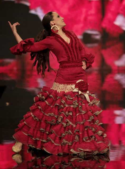 Models wear a creation by Spanish designer Vicky Martin Verrocal during the International Flamenco Fashion Show in Seville, Spain. (Photo by Miguel Angel Morenatti/AP Photo)