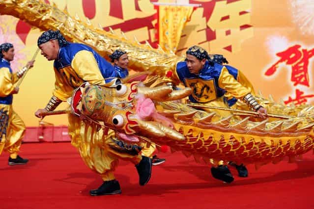 Chinese folk artists perform during the opening ceremony of the Spring Festival Temple Fair at Dragon Lake Park on February 9, 2013 in Beijing, China.The Chinese Lunar New Year of Snake also known as the Spring Festival, which is based on the Lunisolar Chinese calendar, is celebrated from the first day of the first month of the lunar year and ends with Lantern Festival on the Fifteenth day. (Photo by Lintao Zhang)