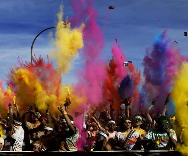 Participants in the Color Run Las Vegas throw colored powder into the air after participating in the run and walk on February 16, 2013. (Photo by John Locher/Las Vegas Review-Journal)