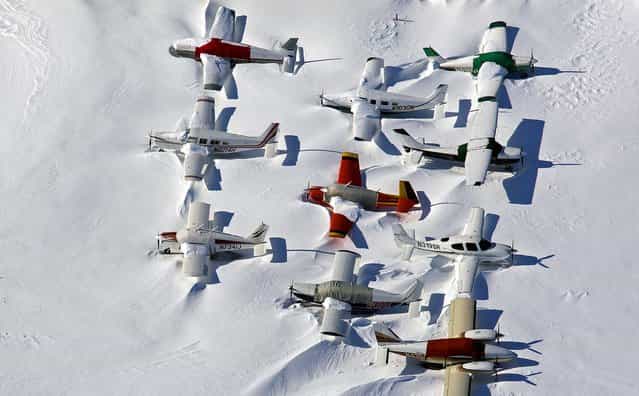 Small planes are snowed in at the closed Bridgeport, Connecticut airport in the aftermath of Nemo, the Blizzard of 2013. (Photo by Craig Ruttle/Associated Press)