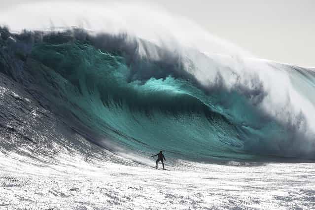 Australian surfer Marti Paradisis rides a wave near Pedra Branca Rock, south of Tasmania in the Southern Ocean in this in this file photograph taken in November 2012 in this picture provided by Big Wave Awards. Paradisis won the [Biggest Wave] section of the Australiasian Big Wave Awards, which included $20,000 prize-money. Picture taken November 2012. (Photo by Andrew Chisholm/Reutars/Big Wave Awards)