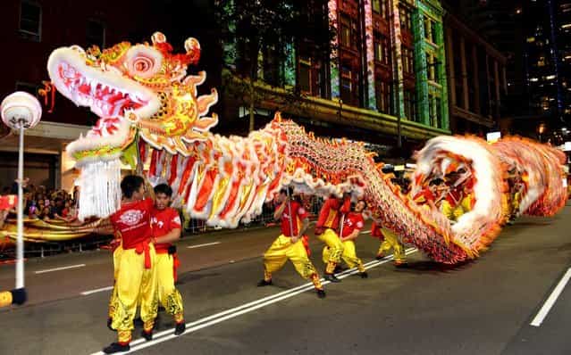 A dragon entertains the crowds at the Chinese New Year parade in Sydney on February 17, 2013. The parade featured more than 3,500 performers from Australia and China, including 120 performers from Shenzhen, Sydney's offical partner city for this year's festival. (Photo by William West/AFP Photo)