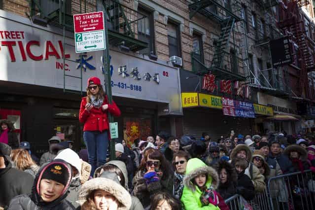 Parade-goers lined the streets of New York's Chinatown during the 14th Annual Chinatown Lunar New year Parade on February 17, 2013 in New York City. This year celebrates the Year of the Snake. (Photo by Michael Nagle)