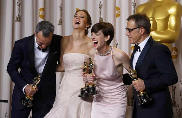 Daniel Day Lewis (L), best actor winner for [Lincoln], Jennifer Lawrence, best actress winner for [Silver Linings Playbook], Anne Hathaway, best supporting actress winner for [Les Miserables] and Christoph Waltz, best supporting actor winner for [Django Unchained], pose with their Oscars backstage at the 85th Academy Awards in Hollywood, California, February 24, 2013. (Photo by Mike Blake/Reuters)