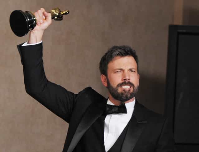Ben Affleck poses with his award for best picture for [Argo] during at the Oscars at the Dolby Theatre on Sunday February 24, 2013, in Los Angeles. (Photo by John Shearer/Invision/AP)