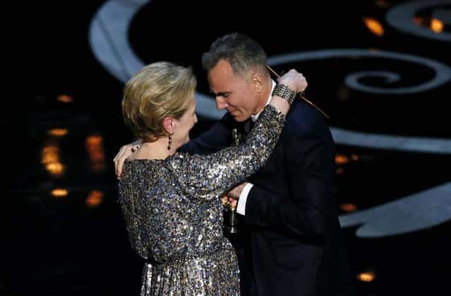 Daniel Day-Lewis and Meryl Streep embrace after Streep presented Day-Lewis with the award for best actor in a leading role for his performance in [Lincoln]. Day-Lewis became the first male actor to win three leading role Oscars. (Photo by Robert Gauthier/Los Angeles Times/MCT)