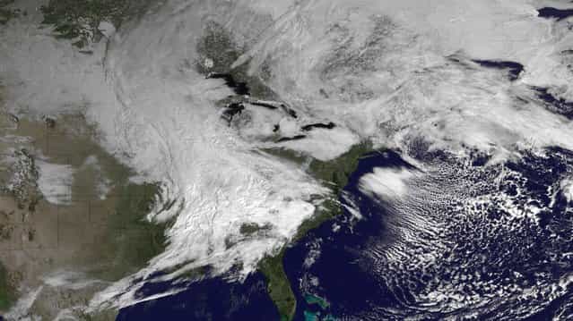 A winter storm system is seen over Canada and the eastern United States in this March 5, 2013 satellite image courtesy of NOAA. The late winter storm dumped heavy snow on the midwestern United States on Tuesday, contributing to numerous highway crashes and flight cancellations as it moved east toward the Ohio Valley and the mid-Atlantic states. (Photo by Reuters/NOAA)