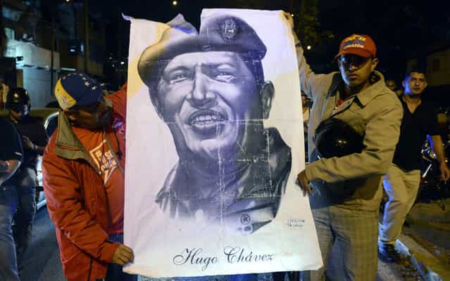 Venezuelan President Hugo Chavez hold design in support of the president of Venezuela, who died on Tuesday. (Photo by Juan Barreto/AFP Photo)