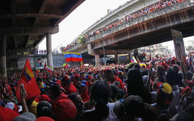 Viaducts and streets were packed for the passage of the procession of Chávez. (Photo by Carlos Garcia Rawlins/Reuters)