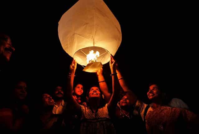 Activists of the All India Peace and Solidarity Organization release a sky lantern on International Women's Day in Hyderabad, India. (Photo by Mahesh Kumar A./Associated Press)
