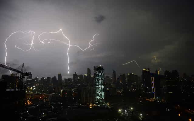 Lightnings sparkle in the sky of Jakarta, Indonesia – during a storm on March 4, 2013. (Photo by Romeo Gacad/AFP Photo)