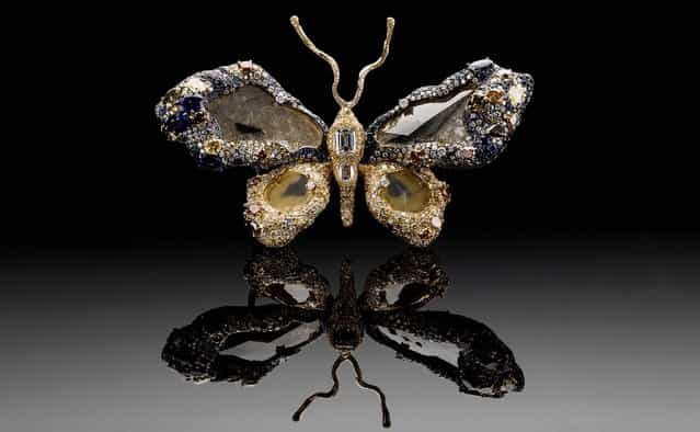 On Wednesday, March 5, 2013, the Smithsonian's National Museum of Natural History will put on display the newest addition to its famous gem collection with a butterfly brooch made of 2,300 gems. The [Royal Butterfly Brooch], seen in an undated photo, was created in 2009 by Taiwanese jewelry artist Cindy Chao. She is donating the piece to the museum, making it the first Taiwanese-designed item in the National Gem Collection. The Royal Butterfly is composed of 2,328 gems, totaling 77 carats. It includes colored and color-changing sapphires and diamonds, rubies and tsavorite garnets. The centerpieces of the butterfly's wings are four large-faceted diamond slices. (Photo by Don Hurlbert/Smithsonian' Instutution)