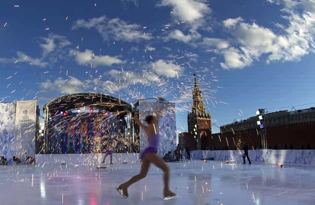 Skaters perform during celebrations launching the one-year countdown for the 2014 Sochi Winter Paralympics in Moscow's Red Square, on March 7, 2013. (Photo by Alexander Zemlianichenko/Associated Press)