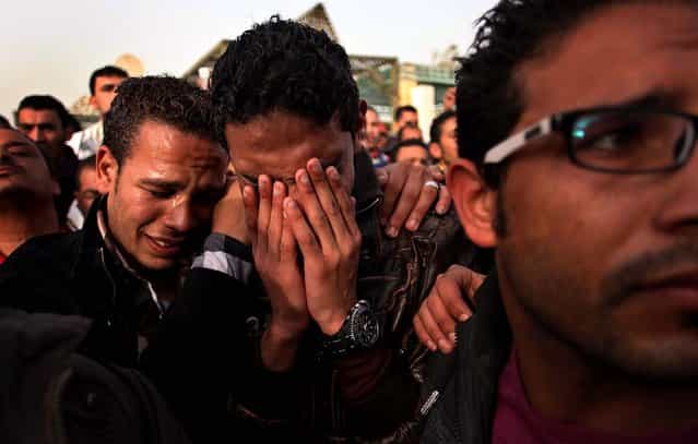 Egyptians mourn during the funeral for Abd Alhaleem Mohanna, 23, who was killed on March 5 during clashes with police, in Port Said. Egypt's police forces have withdrawn from the streets of this restive city on the Suez Canal, handing over security to the military after nearly a week of deadly clashes. (Khalil Hamra/Associated Press)