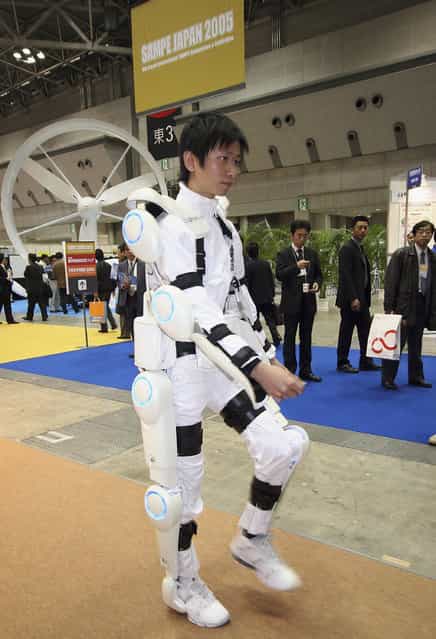 Robot suit "Hybrid Assistive Limb (HAL)" worn by a man developed by University of Tsukuba is seen during 2005 International Robot Exhibition on November 30, 2005 in Tokyo, Japan. By wearing the power suit, it makes it easier to move and lift heavy things. The Exhibition is on until December 3. (Photo by Koichi Kamoshida)