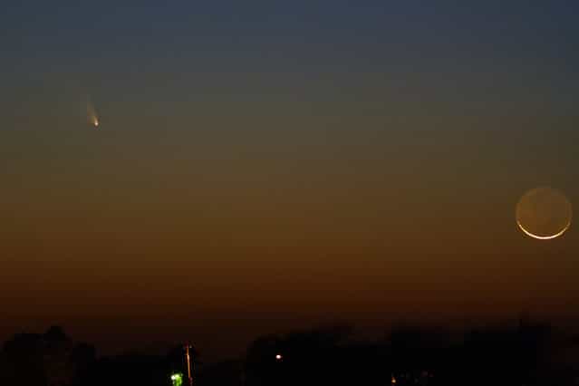 Comet PanSTARRS & The Moon, on March 12, 2013 in Louisiana. This is a single 2 second exposure with a Canon 200mm F/2.8 lens, a Canon XS (modified) and ISO 800 settings. (Photo by Mike B.)