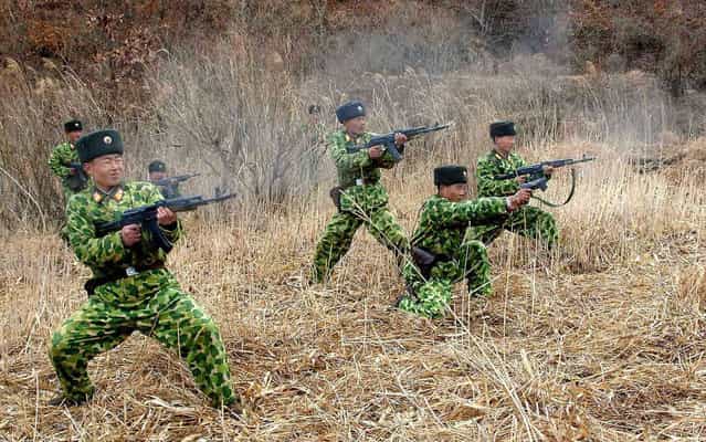 North Korean soldiers with weapons attend military training in an undisclosed location in this picture released by the North’s official KCNA news agency in Pyongyang March 11, 2013. South Korea and U.S. forces are conducting large-scale military drills until the end of April, while the North is also gearing up for a massive state-wide military exercise. North Korea has accused the U.S. of using the military drills in South Korea as a launch pad for a nuclear war and has threatened to scrap the armistice with Washington that ended the 1950-53 Korean War. (Photo by KCNA/Reuters)