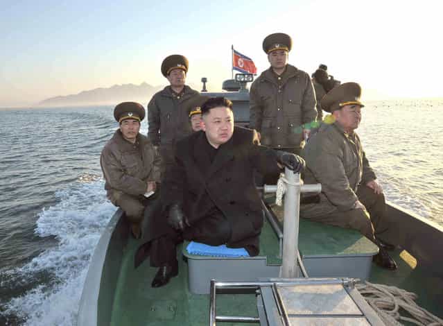 In this March 11, 2013 photo released by the Korean Central News Agency (KCNA) and distributed March 12, 2013 by the Korea News Service, North Korean leader Kim Jong Un rides on a boat, heading for the Wolnae Islet Defense Detachment, North Korea, near the western sea border with South Korea. North Korea's young leader urged front-line troops to be on [maximum alert] for a potential war as a state-run newspaper said Pyongyang had carried out a threat to cancel the 1953 armistice that ended the Korean War. (Photo by AP Photo/KCNA via KNS)