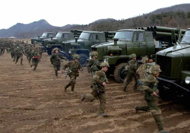 North Korean soldiers run as they attend military training in an undisclosed location in this picture released by the North's official KCNA news agency in Pyongyang March 11, 2013. South Korea and U.S. forces are conducting large-scale military drills until the end of April, while the North is also gearing up for a massive state-wide military exercise. North Korea has accused the U.S. of using the military drills in South Korea as a launch pad for a nuclear war and has threatened to scrap the armistice with Washington that ended the 1950-53 Korean War. (Photo by KCNA/Reuters)