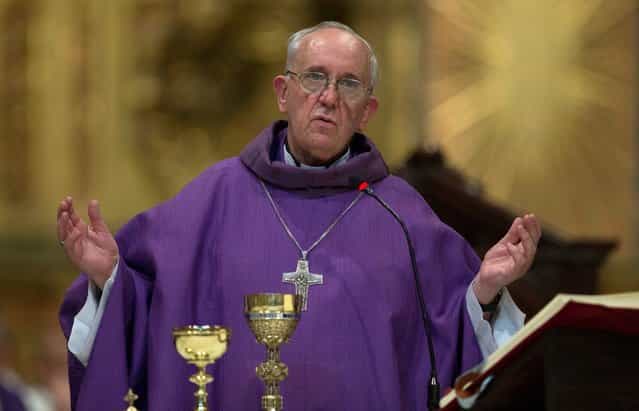 This February 14, 2013 photo shows Archbishop of Buenos Aires, Cardinal Jorge Mario Bergoglio leading a mass at the Metropolitan Cathedral in Buenos Aires, Argentina. (Photo by Natacha Pisarenko/AP Photo)