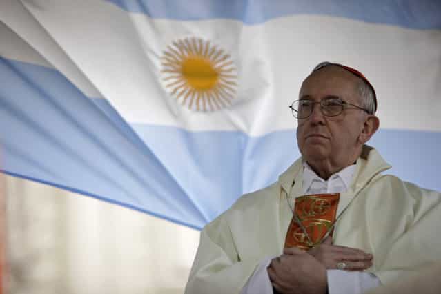 This August 7, 2009 file photo shows Argentina's Cardinal Jorge Bergoglio giving a mass outside the San Cayetano church in Buenos Aires. Bergoglio, who took the name of Pope Francis, was elected on Wednesday, March 13, 2013 the 266th pontiff of the Roman Catholic Church. (Photo by Natacha Pisarenko/AP Photo)