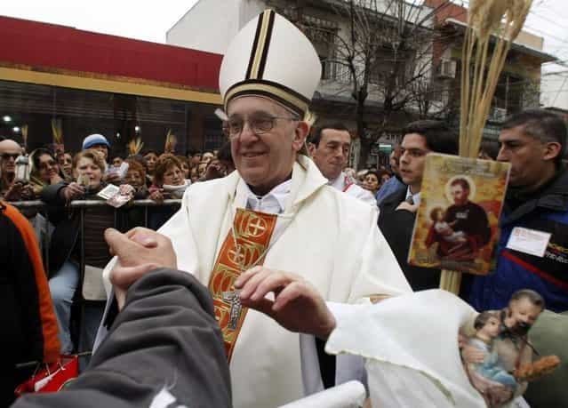 Archbishop of Buenos Aires Cardinal Jorge Mario Bergoglio greets worshippers, in the Buenos Aires neighbourhood of Liniers, in this August 7, 2009 file photograph. Bergoglio was elected Pope to succeed Pope Benedict on March 13, 2013, and took the name of Pope Francis. (Photo by Marcos Brindicci/Reuters)