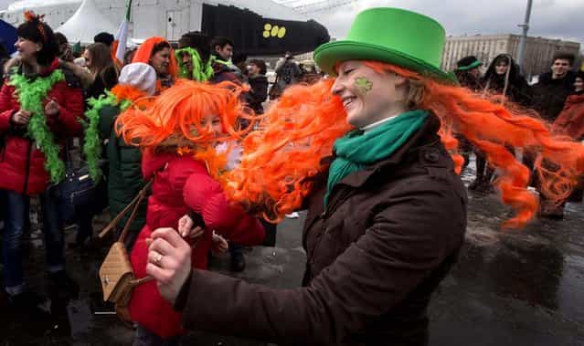 People dance during a St. Patrick's Day Parade in Moscow, on March 16, 2013. (Photo by Misha Japaridze/Associated Press)