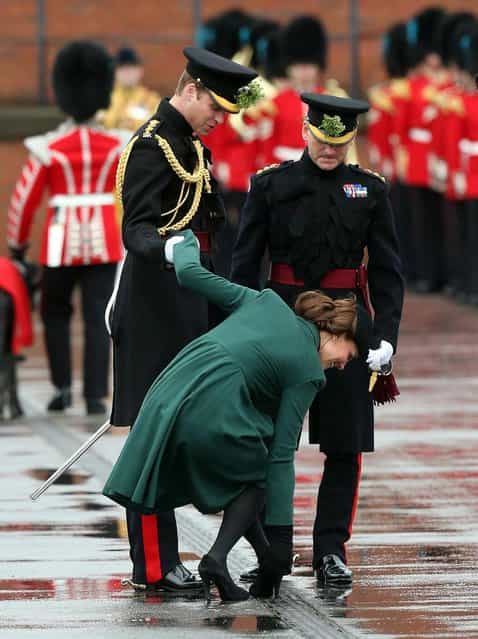 The Duchess of Cambridge gets her heel stuck in a drain as the Duke and Duchess of Cambridge visit the 1st Battalion Irish Guards to attend the St. Patrick's Day Parade at Mons Barracks, Aldershot, on March 17, 2013. (Photo by Steve Parsons/PA Wire)