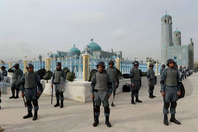 Afghan policemen stand guard at the shrine of Hazrat-i Ali ahead of [Nowruz], the Persian New Year in Mazar-i-Sharif on March 20, 2013. (Photo by Shah Marai/AFP Photo)